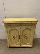 A painted side cabinet with floral details to doors (H76cm W70cm D26cm)