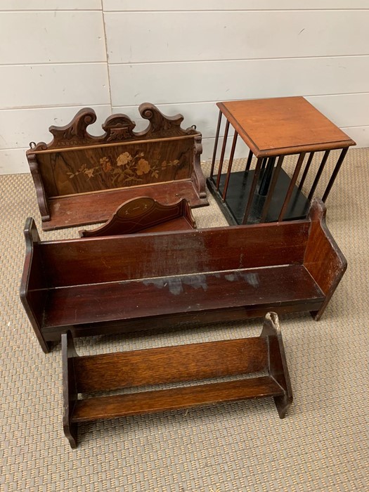 A selection of mahogany and inlay book racks along with a Edwardian mahogany table top revolving