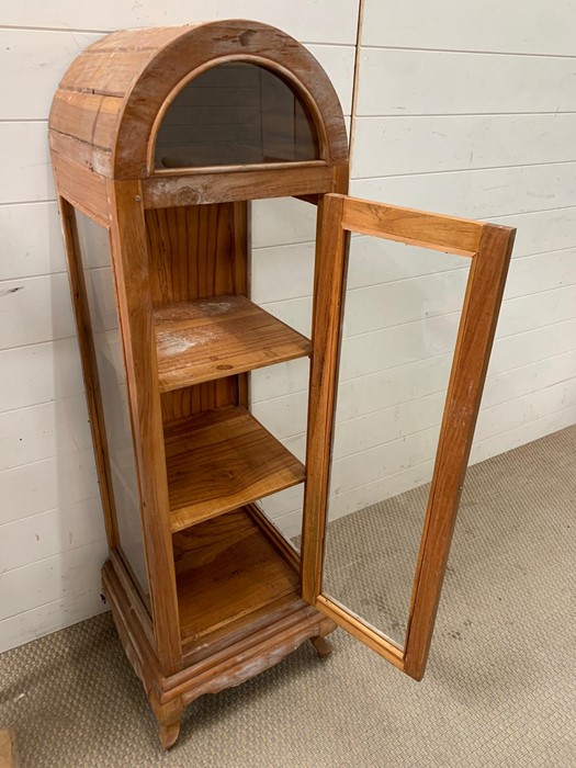 A pine display case on legs and dome top (H125cm W35cm D35cm)