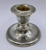 A Silver squat candlestick by James Deakin & Sons Chester 1913, 6 cm high.