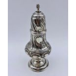 A silver sugar shaker with indistinct hallmarks, approx 16 cm high and 102g