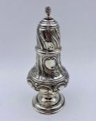 A silver sugar shaker with indistinct hallmarks, approx 16 cm high and 102g