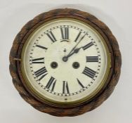 A solid oak carved wall clock (Dia 29cm)