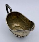 A small silver milk jug, 39g, hallmarked for Birmingham