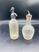 Two cut glass miniature bar bottles, one cordial bottle with white metal sprout and one miniature