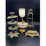 A selection of brass items including a onyx and gilt metal cigarette holder and ashtray