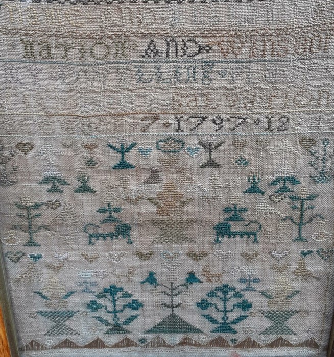 An 18th century Sampler worked in silk on linen ground, in a variety of stitches. Alphabets A-Z in - Image 2 of 3