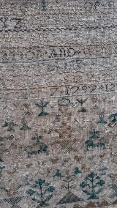 An 18th century Sampler worked in silk on linen ground, in a variety of stitches. Alphabets A-Z in - Image 3 of 3