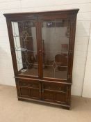 A reproduction display cabinet with lead glass and three glass shelves (H160cm W108cm D38cm)