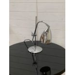 A chrome angle poise contemporary lamp