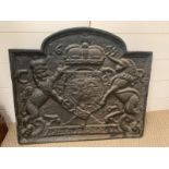 A Cast iron fire back, crested with a coat of arms 53cm x 60 cm