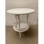 A small painted occasional table with galleried shelf Diameter 54cm x 65cm High