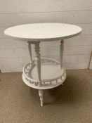 A small painted occasional table with galleried shelf Diameter 54cm x 65cm High