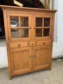 A glazed cabinet with doors opening to reveal shelves, three drawers and cupboard below (H171cm