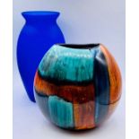 A Poole Pottery Gemstones vase 20cm H and a blue glass vase.