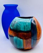 A Poole Pottery Gemstones vase 20cm H and a blue glass vase.