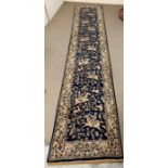 A blue runner with woodland theme (392cm x 78cm)