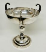 A Chinese three handled cup by silversmiths Luenwo (575g)