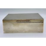 A silver cigarette box by Asprey, hallmarked for Chester 1917.