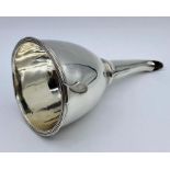 A Georgian silver wine funnel, with removable inset strainer, hallmarked for London 1797.(140g)