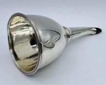 A Georgian silver wine funnel, with removable inset strainer, hallmarked for London 1797.(140g)