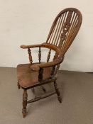 A 19th century yew and elm Windsor chair, the high double back with shaped and pierced splats turned