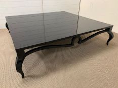 A large low black lacquered coffee/centre table on cabriole legs (H37cm SQ142cm)