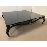 A large low black lacquered coffee/centre table on cabriole legs (H37cm SQ142cm)