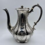 A Victorian silver coffee pot, engraved with foliate decoration and finial by Martin, Hall & Co (