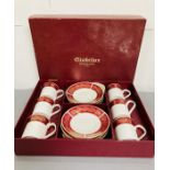 A boxed coffee can and saucers set "Elizabetham" Burgundy