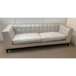 A large three seater Alexander square sofa with button back possibly by The Sofa and Chair