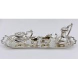 A silver miniature tea set by A Chick & Sons Ltd, hallmarked for London 1975