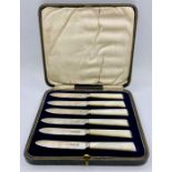 A Boxed set of six silver and mother of pearl fruit knives. Hallmarked for Sheffield 1924 by Isaac
