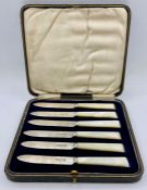 A Boxed set of six silver and mother of pearl fruit knives. Hallmarked for Sheffield 1924 by Isaac