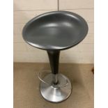 A grey kitchen stool on chrome base