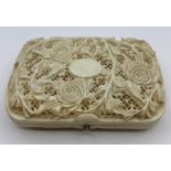 An Antique carved ivory cigarette case with rose theme