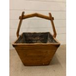 A wooden rice bucket