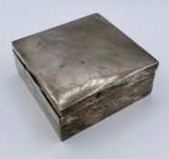 A silver cigarette box, makers mark WA and hallmarked for Birmingham.