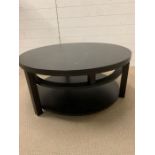 A circular low contemporary centre table with shelf under (H44cm Dia 99cm)