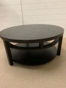 A circular low contemporary centre table with shelf under (H44cm Dia 99cm)