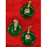 Three 18ct gold and Jade pendants