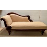 A Regency style chaise longue, upholstered in beige on turned tapering feet with castors (H 92cm d