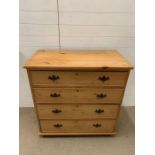 A four drawers antique pine chest of drawers (H98cm W96cm D52cm)