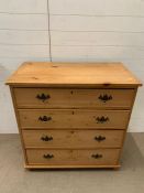 A four drawers antique pine chest of drawers (H98cm W96cm D52cm)