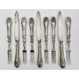 A selection of six silver handled forks and three knives