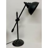 A Contemporary Industrial style desk lamp.