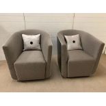 A pair of contemporary tub chairs with faux leather outer and fabric seat (H83cm W77cm D85cm)