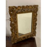 A gilt wood Italian style mirror (42cm x 52cm)