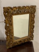 A gilt wood Italian style mirror (42cm x 52cm)