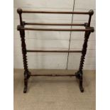 A mahogany towel rail